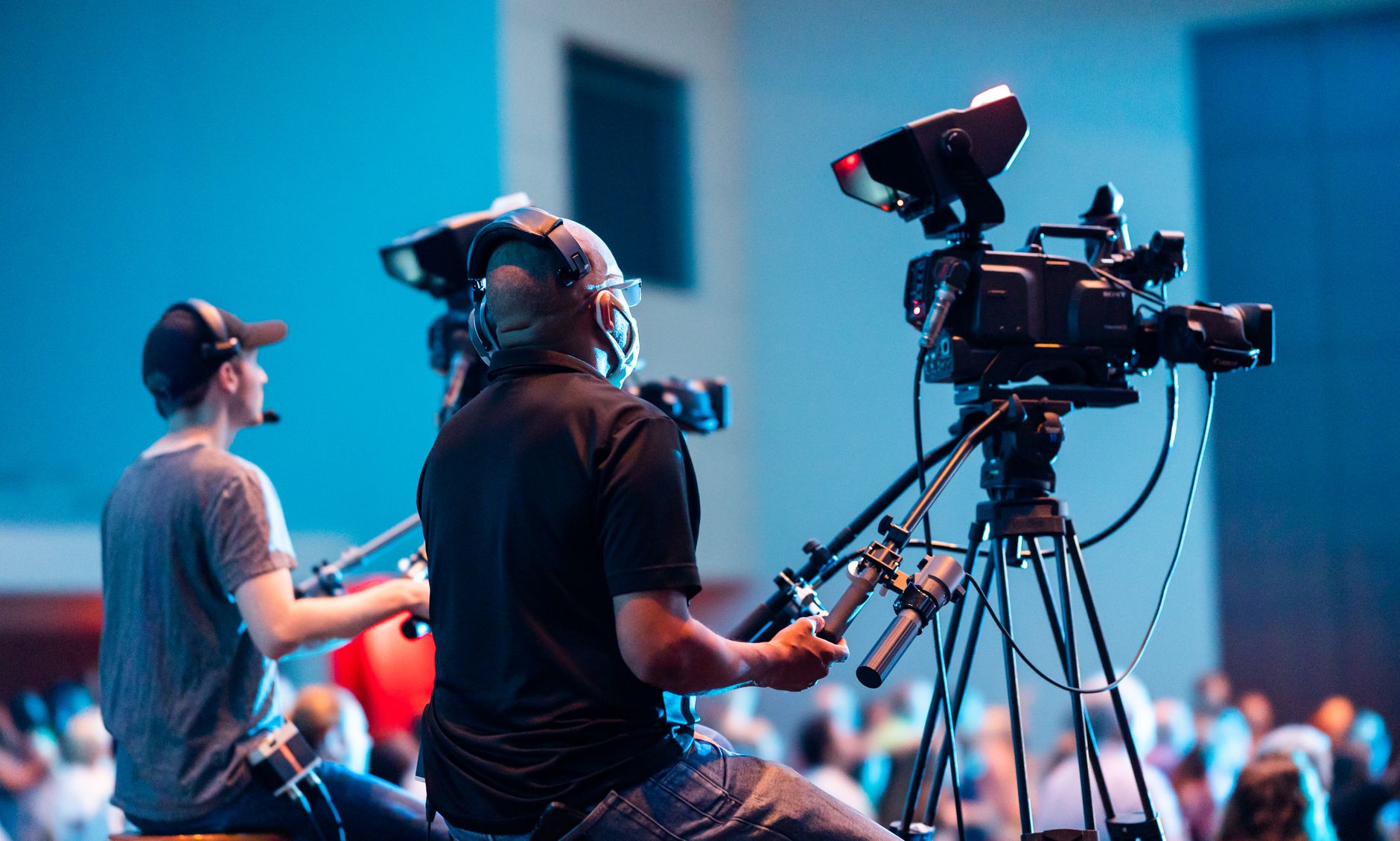 Video production camera setup on tripods with professional lens